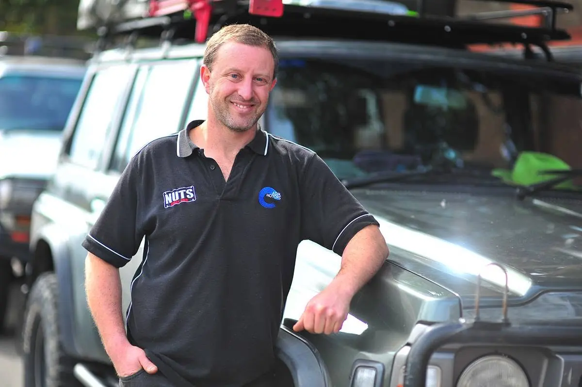 Adam Adler, owner of ADM Motors, beside his Nissan Patrol